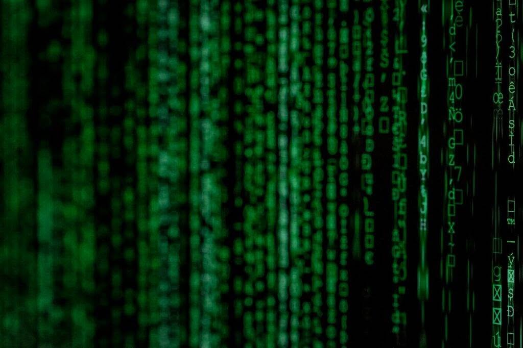 A close up of a green matrix code.
